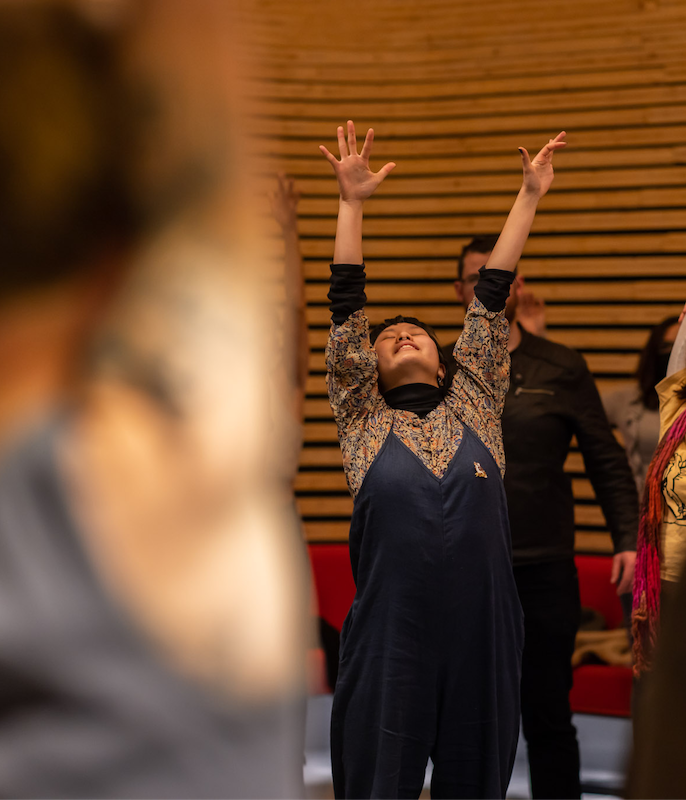 A group of people standing and singing together as part of De-Choiring at Phoenix Central Park